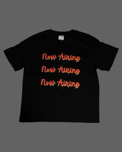 Now Airing “Triple Exclusive” Tee in Black